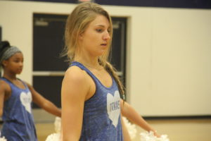 Senior Elise Nill practices her number at Westside Girls practice. She said the most rewarding part is “when you reach your goal at the end of the year because you know all of your hard work finally payed off.” Photo by Emily Mikesell.